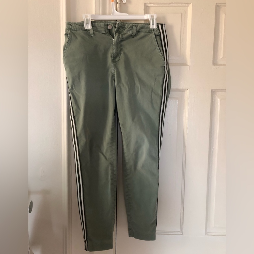 Army green L’Agence skinny pants with sparkly stripe down leg